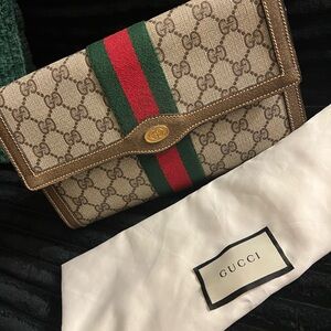 Vintage Gucci brown monogram clutch with the sherryline with gold hardware
